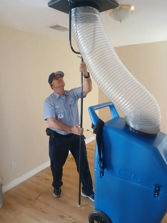 Furnace Tune-Up technician using HEPA equipment in Matteson